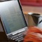 Image of person checking email on computer protected with network security
