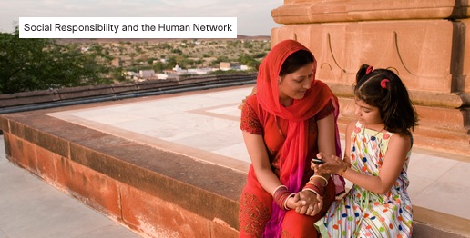 Social Responsibility and the Human Network; photo: Indian mother and daughter outside with mobile device
