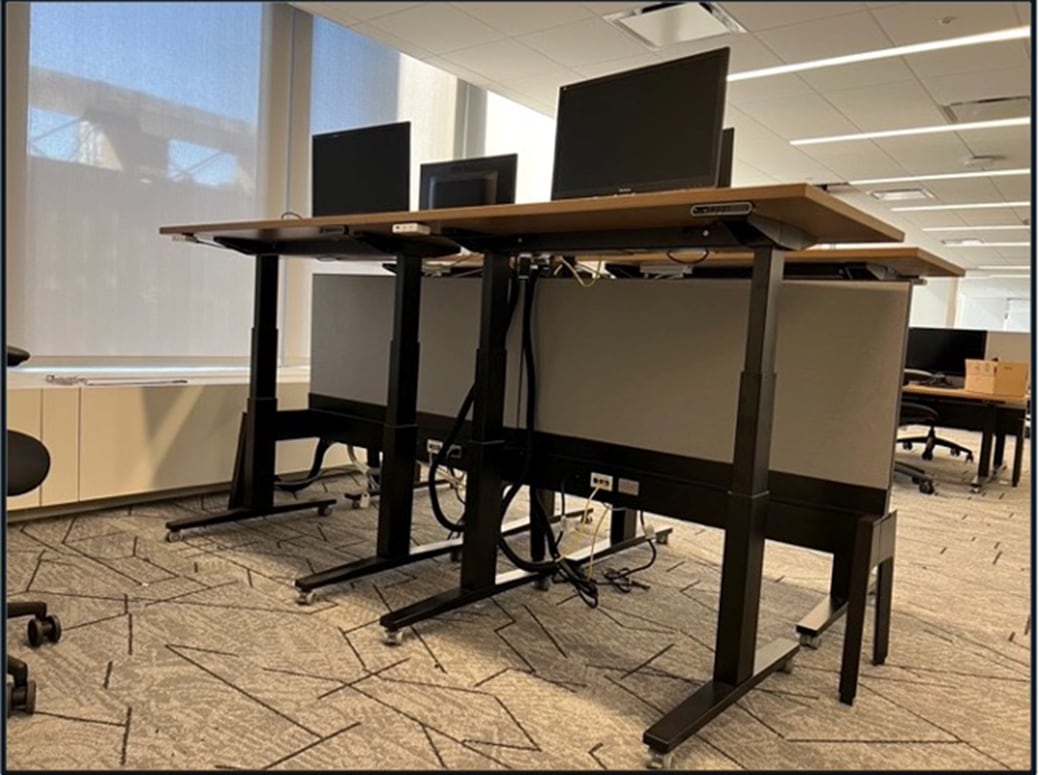 A desk with computers on itDescription automatically generated