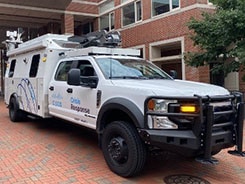 Cisco Network Emergency Response Vehicle (NERV) truck parked outside a brick building