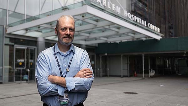 Man in front of hospital