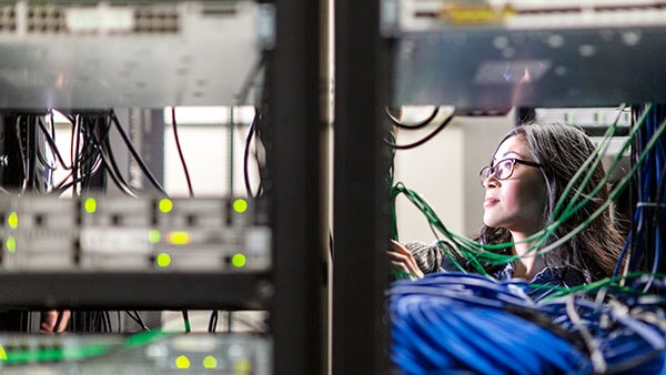 Woman standing in a server room