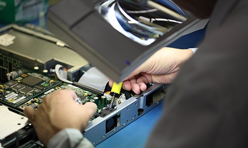 Image of a person working on a network board