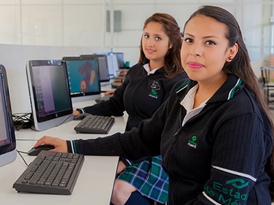 Image of two students at computers