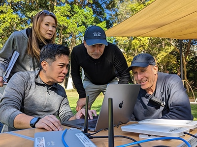 Image of four Cisco employees at a mobile crisis response