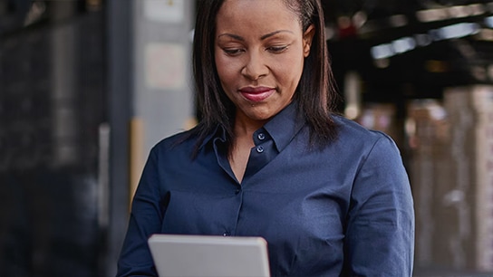 Office worker viewing handheld device